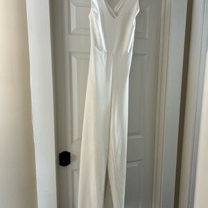 Elegant Cream Halter Jumpsuit with Cross Back.